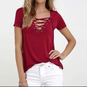 One Maroon and one black lace up short sleeve top